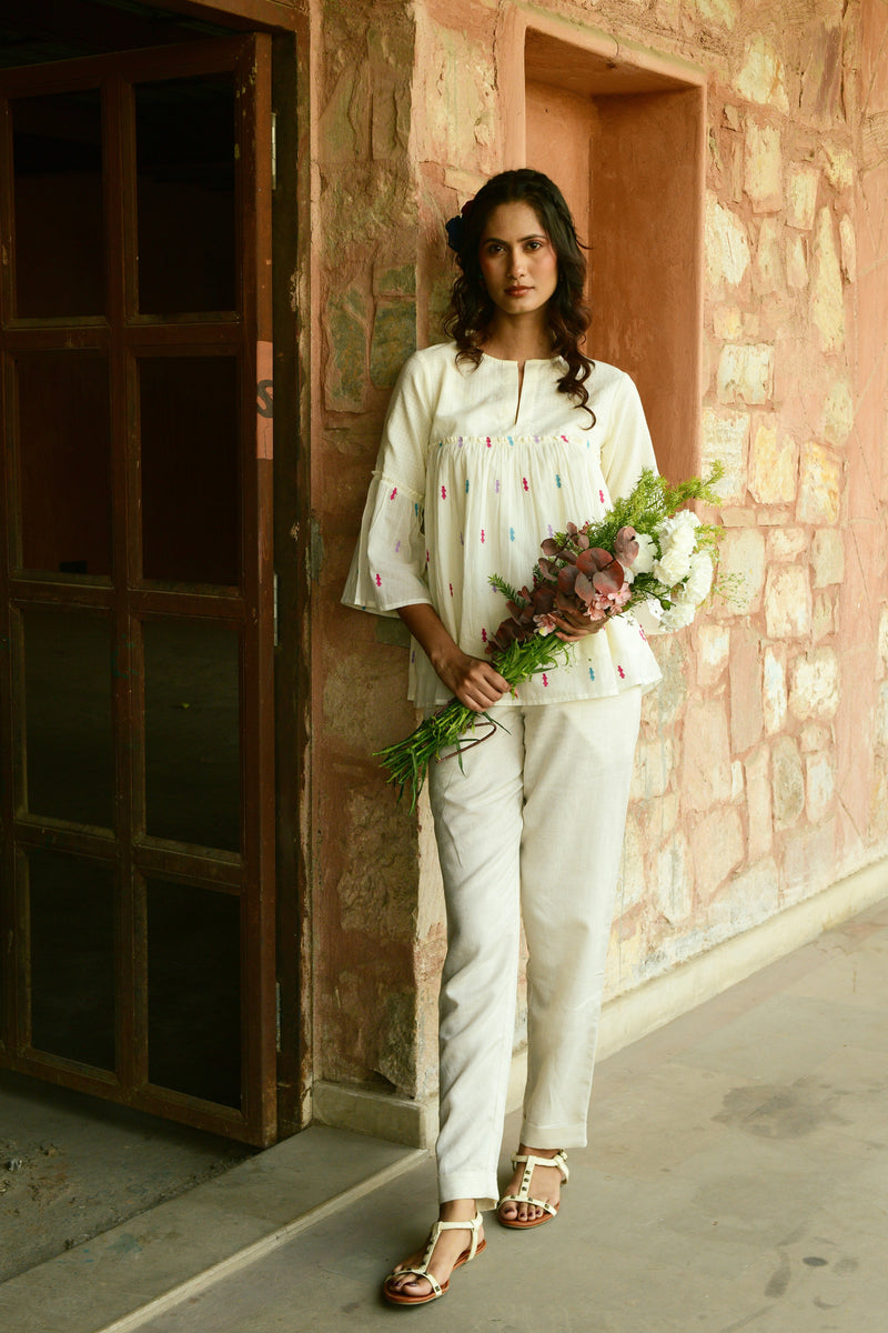 Rosette Ivory High Peplum Top